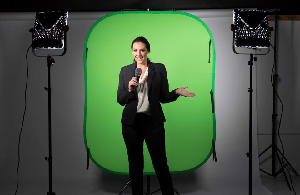 Manfrotto L5981 small collapsible green screen background for hire. image show tv presenter in front of the green screen.