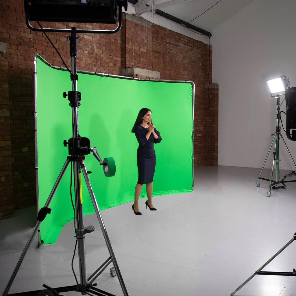 Wide green screen with model showing actual size